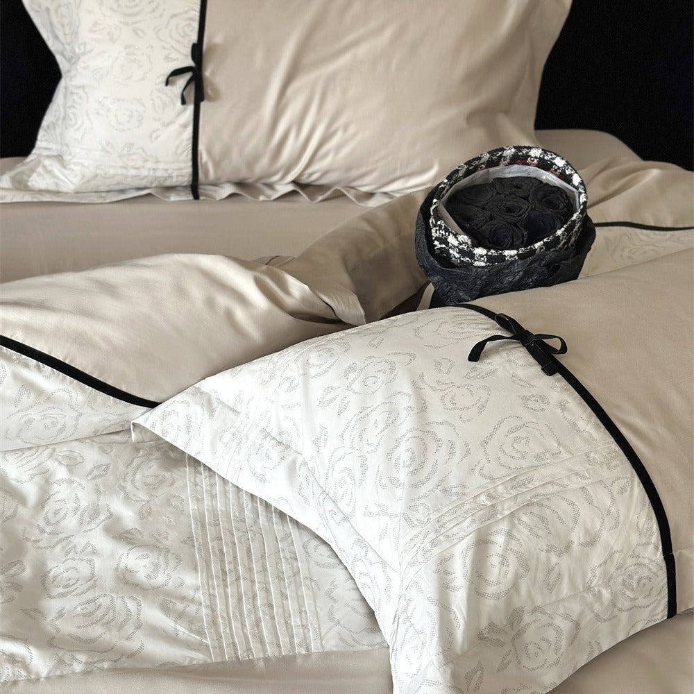 Reversible Duvet Cover Bedding Set with Quilted Jacquard Panel, Black Piped Trim & Decorative Bow Shams