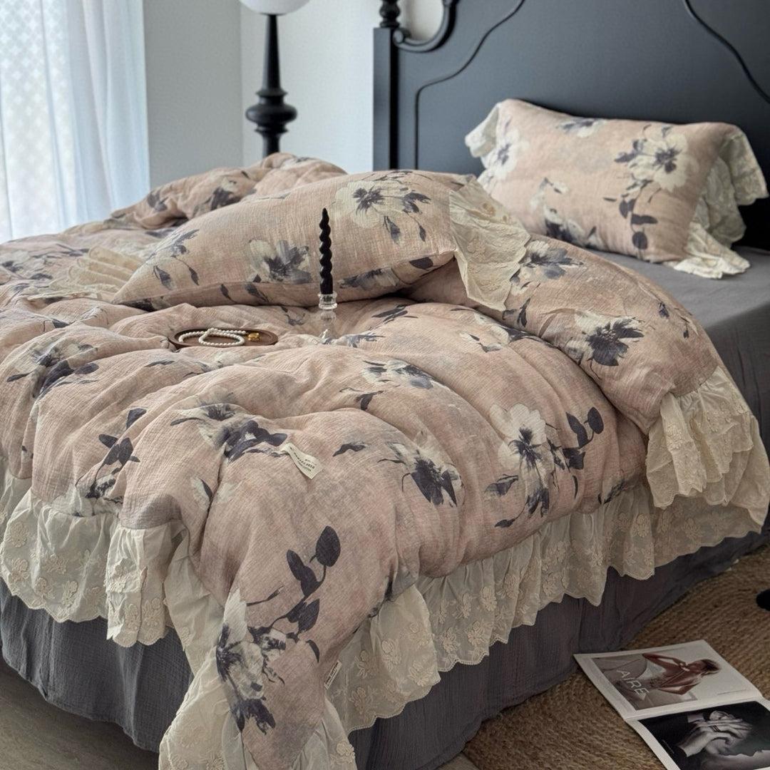 Floral quilted comfort bedspread with lace trim and decorative ruffle