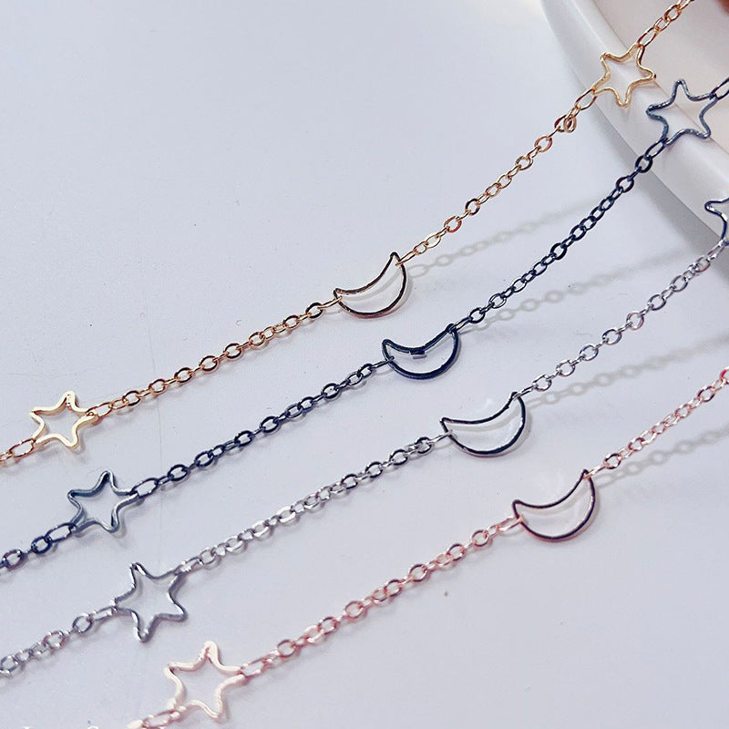 Fashionable glasses holder chain with star and moon motifs Stornfield