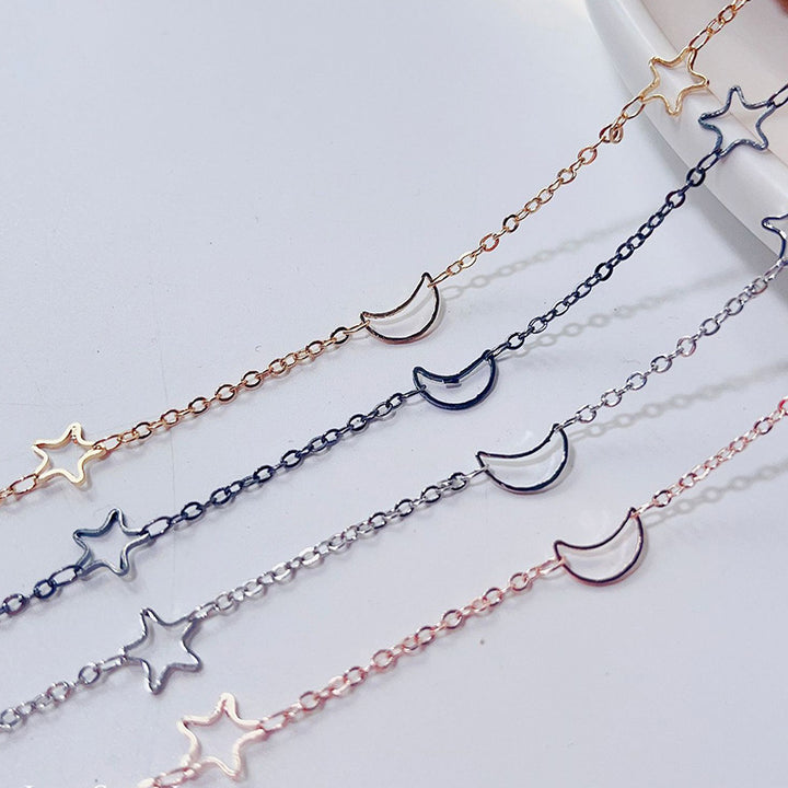 Fashionable glasses holder chain with star and moon motifs Stornfield