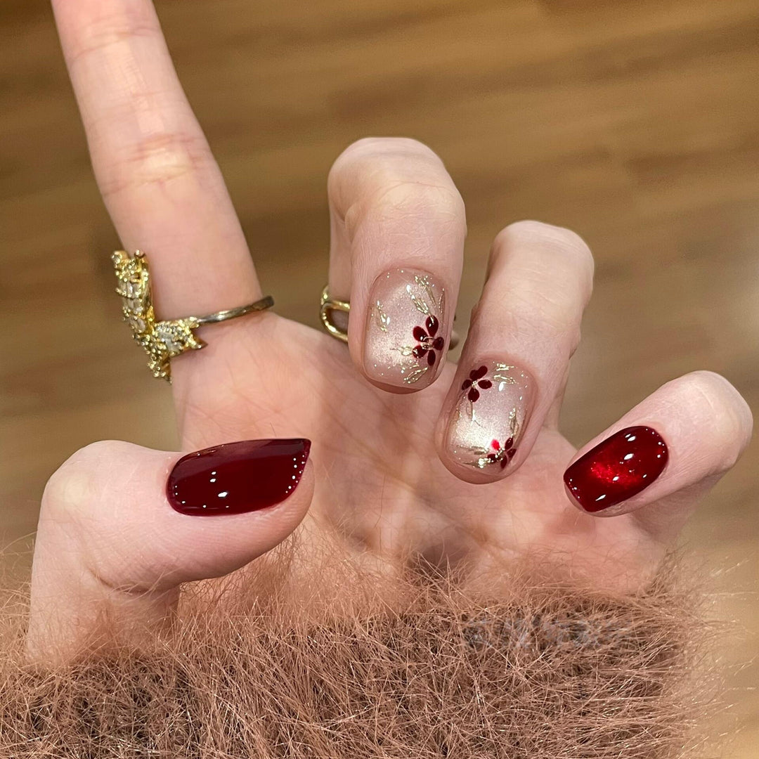 Artificial nails with elegant floral and glitter designs Stornfield