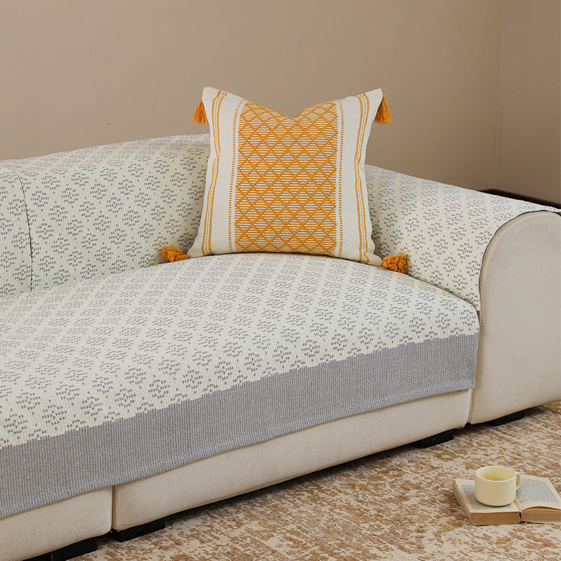 Sofa cover and sofa runner made of knitted cotton blend with non-slip edge