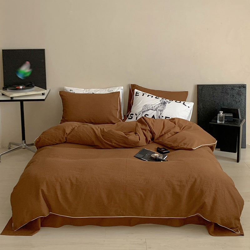 Textured cotton waffle duvet cover with pillowcases and fine contrasting piping