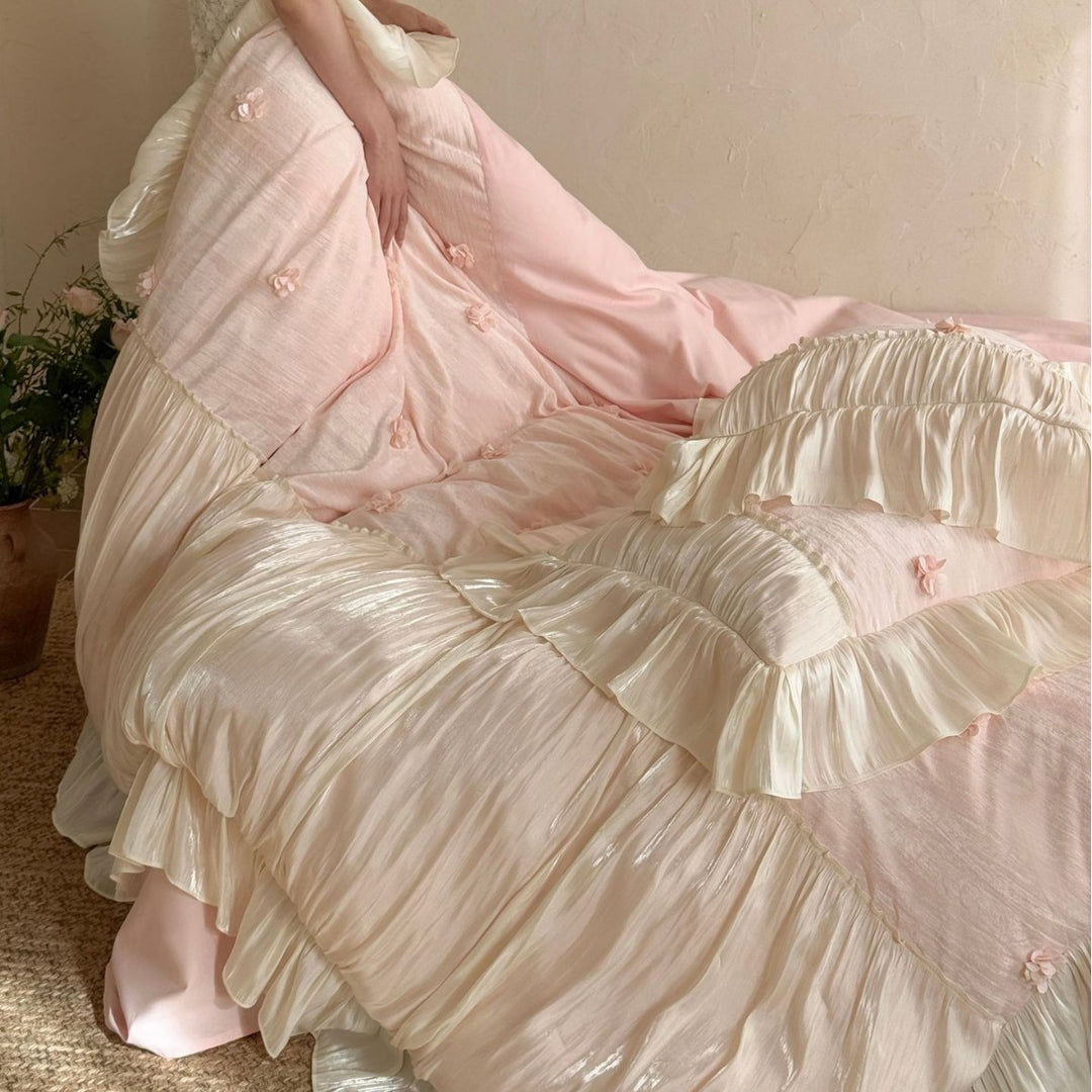 Satin look quilted bedspread with pleated ruffle and 3D flower appliqué