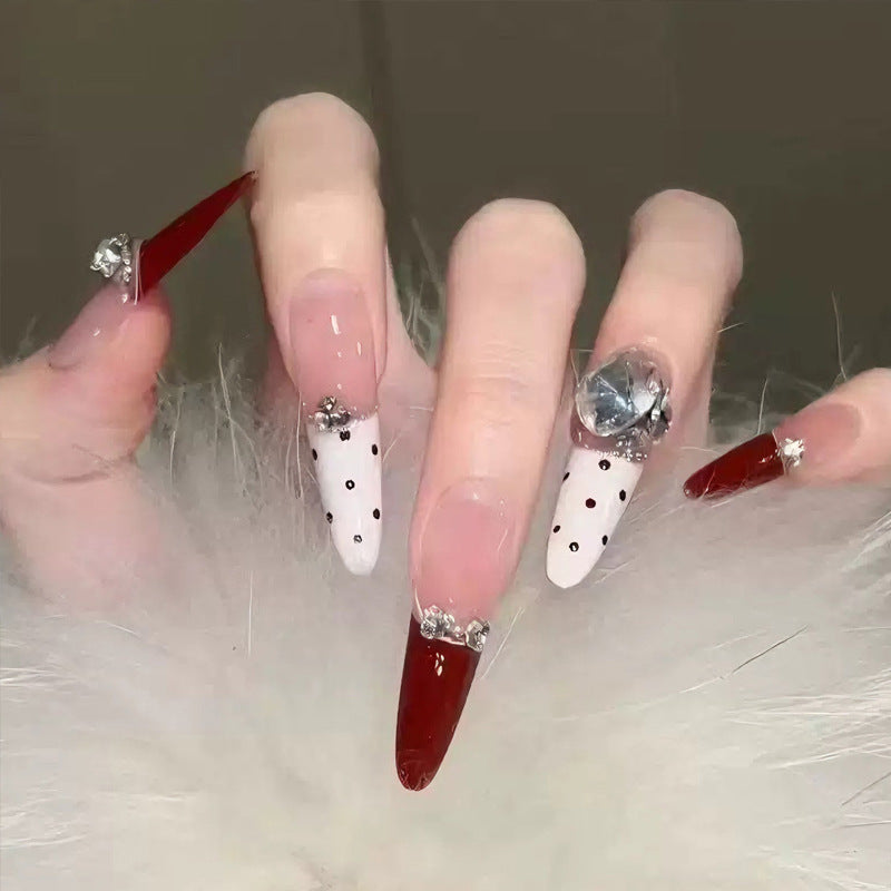 Artificial nail set with festive gift design and elegant glitter accents Stornfield