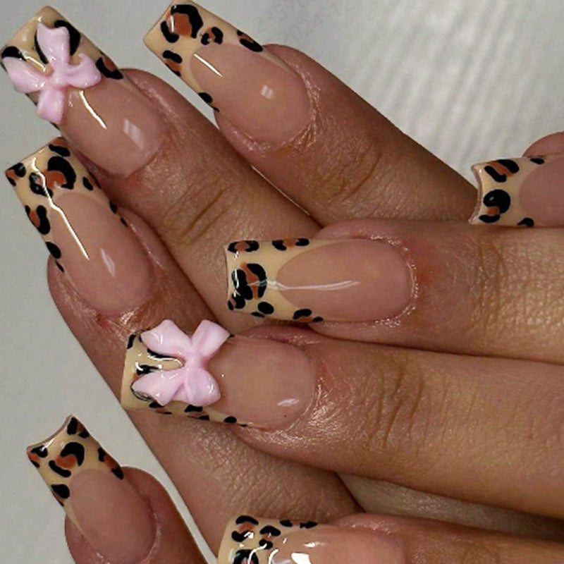 Decorative Stiletto Press-On Nail Art with Animal Print and Bow Accents Stornfield