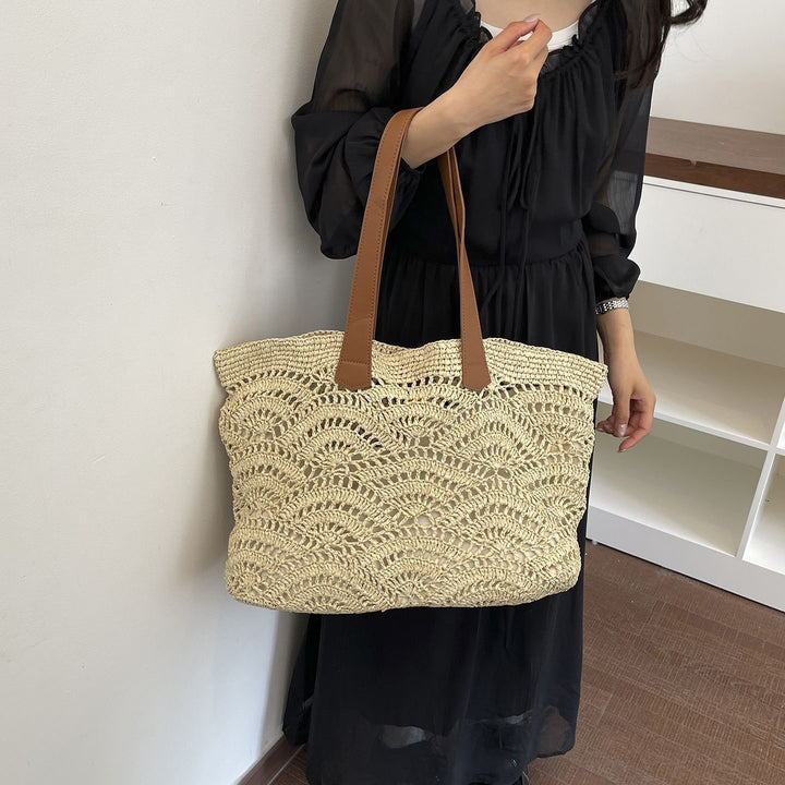Handbag made of high-quality woven natural material with elegant leather handles Stornfield