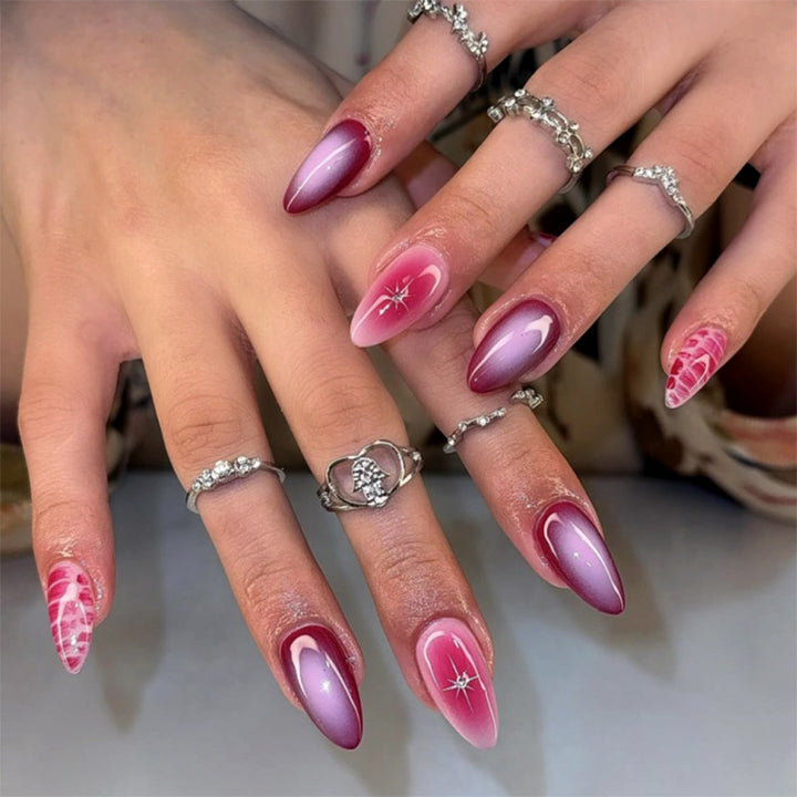Artistic stiletto nails with elegant gradient and delicate accents Stornfield