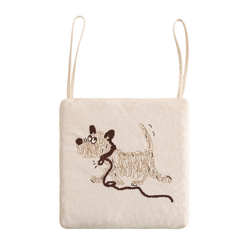 Padded seat cushion with embroidered dog motif and ties Stornfield