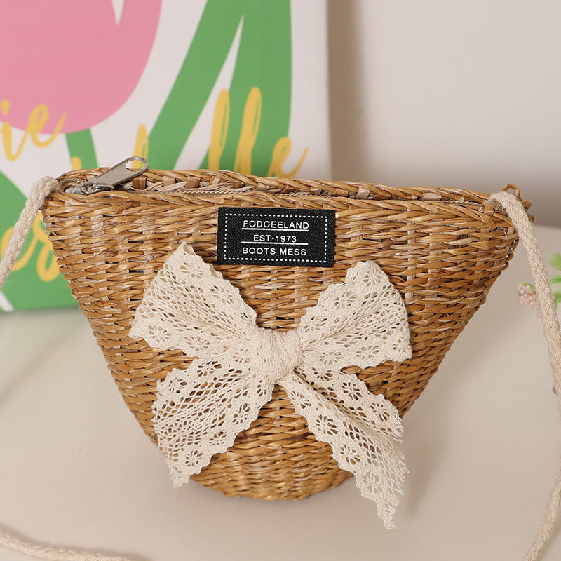 Playful straw shoulder bag with floral accents Stornfield