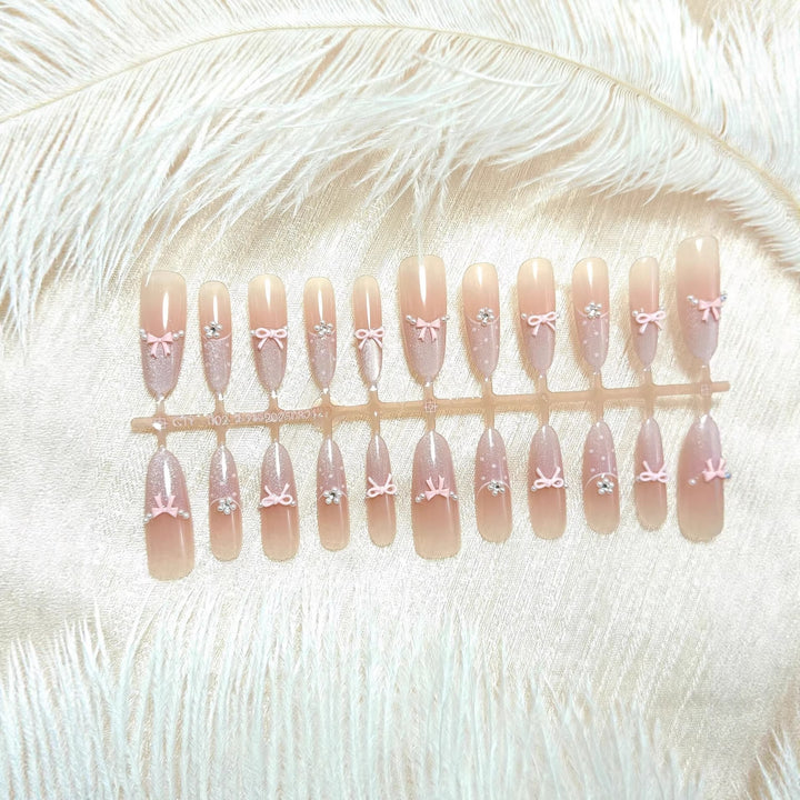 Artificial nails with elegant glitter and bow design Stornfield