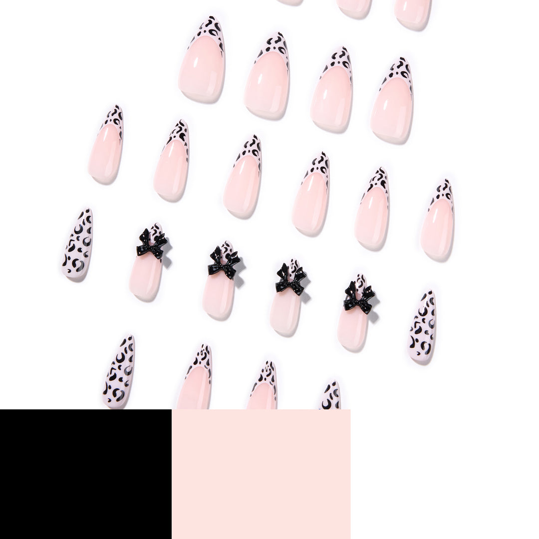 Artful Stiletto Nails with Leopard Print and Bow Accent Stornfield