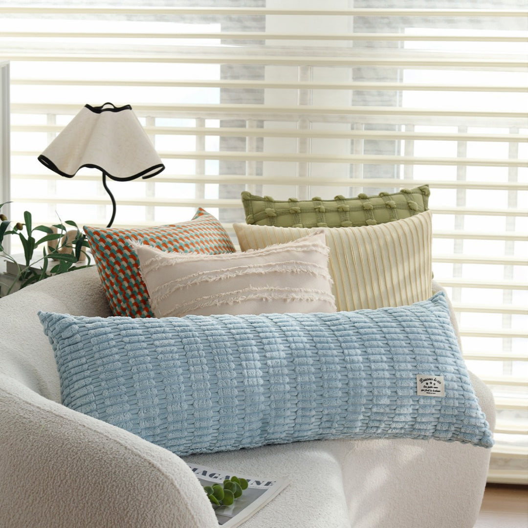 Long decorative pillows with structured surface