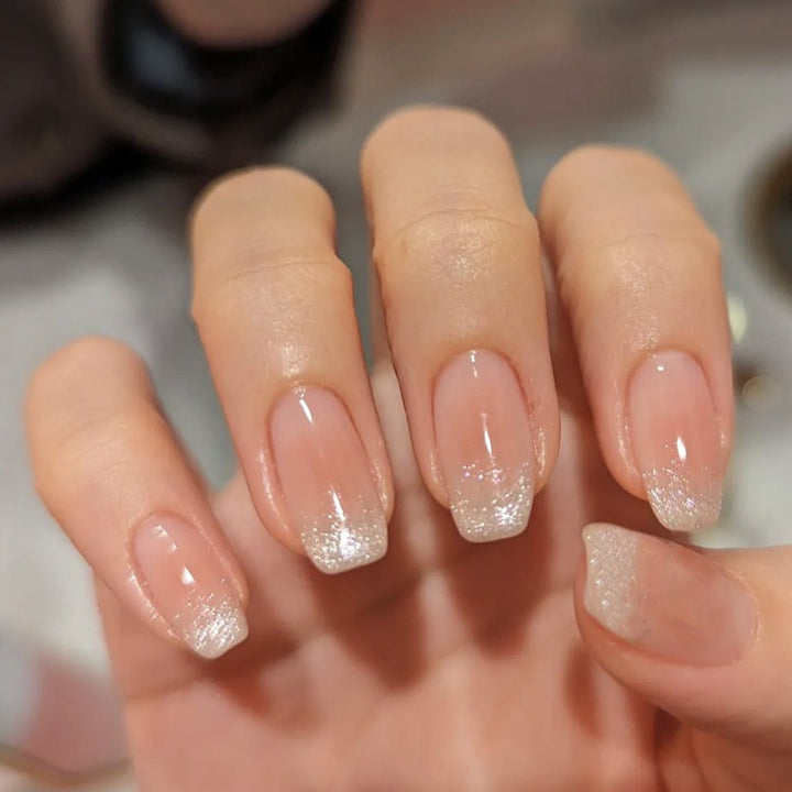 Nail art set with ombre effect and glitter accents Stornfield