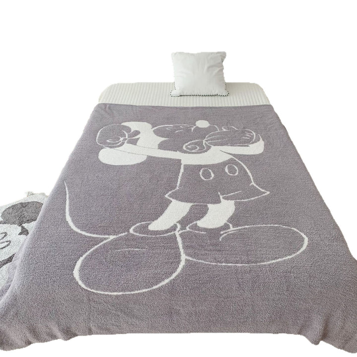 Cozy bedspread made of microfiber with a large woven cartoon motif
