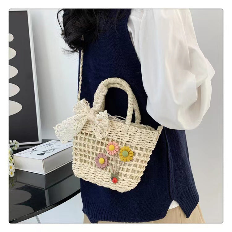 Playful basket bag with floral appliqués Stornfield