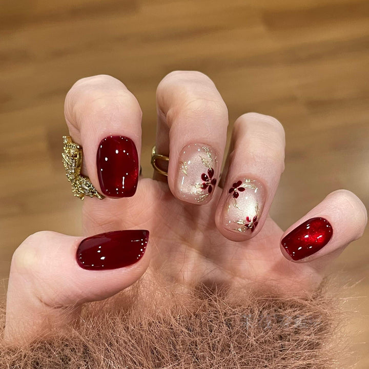 Artificial nails with elegant floral and glitter designs Stornfield