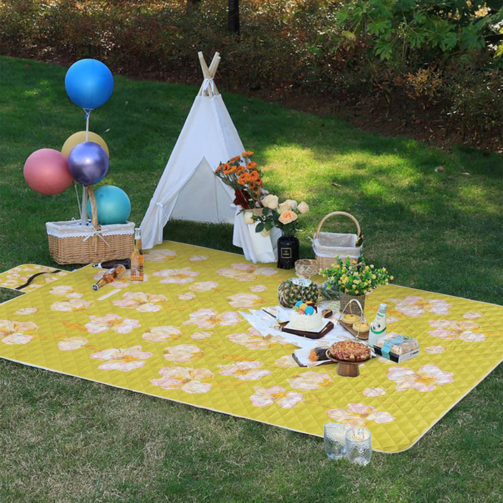 Quilted picnic and beach blanket set with carrying strap and water-repellent back