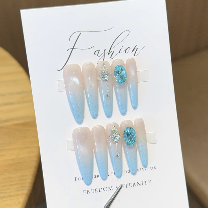 Glamorous artificial nails with sparkling rhinestone details Stornfield