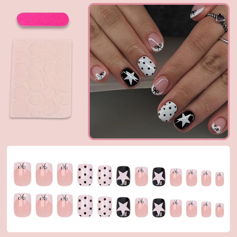 Acrylic nail set with playful dots and star motifs Stornfield