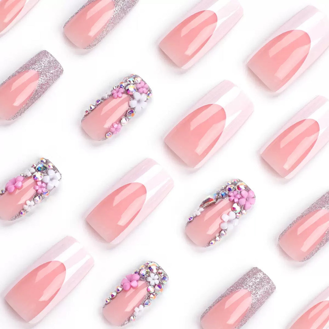 Artificial nail set with elegant 3D flowers and glitter embellishments Stornfield