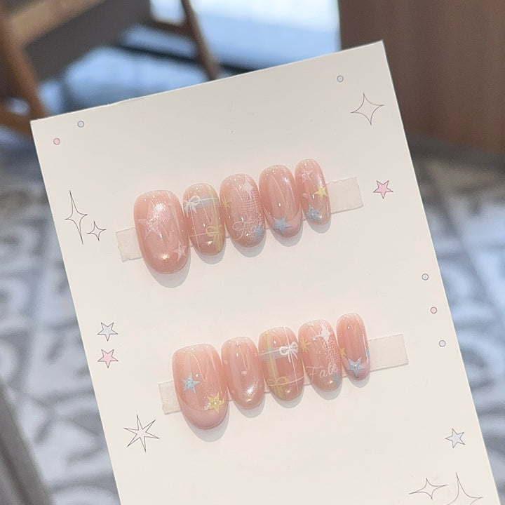 Artificial nails with romantic star and glitter motifs Stornfield