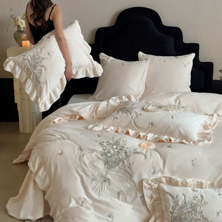 Luxurious bedding set with ruffles and floral embroidery
