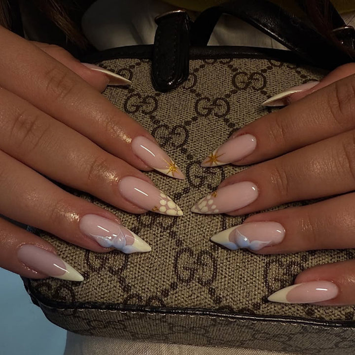 Artificial nail set with elegant floral design and golden accents Stornfield