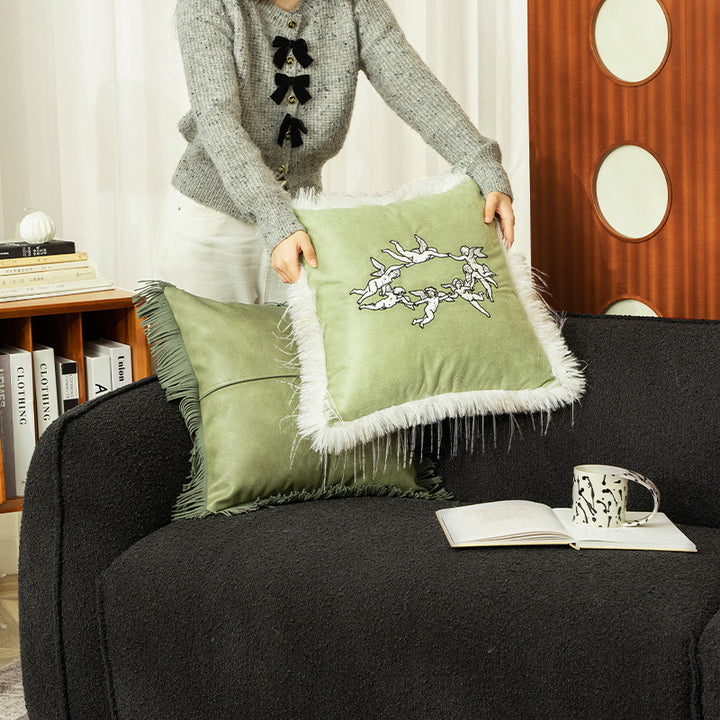 Luxurious decorative velvet cushion with angel embroidery and faux fur trim