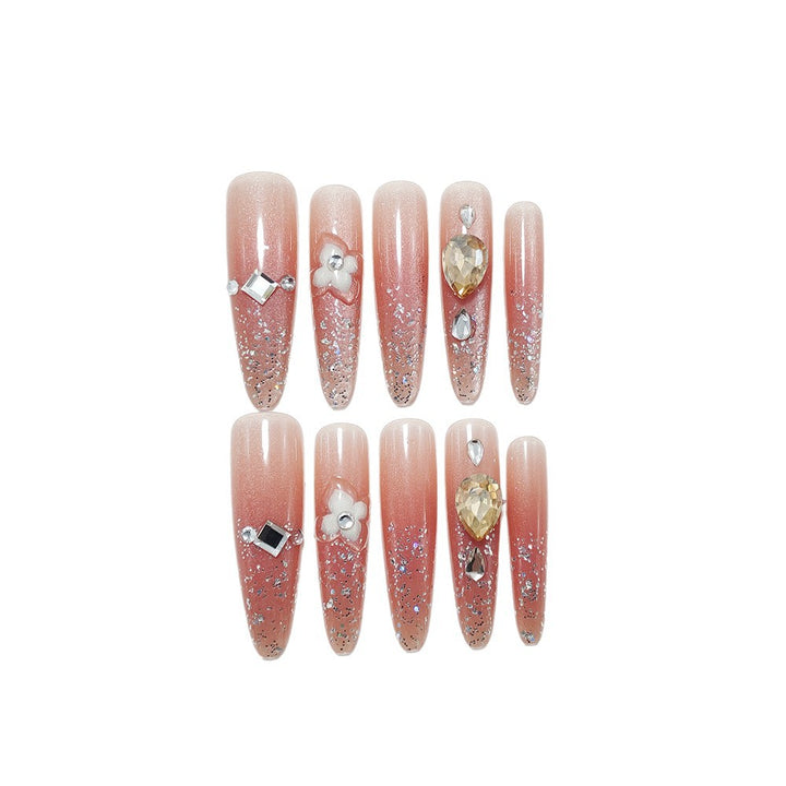 Shiny artificial nails with rhinestones and glitter Stornfield