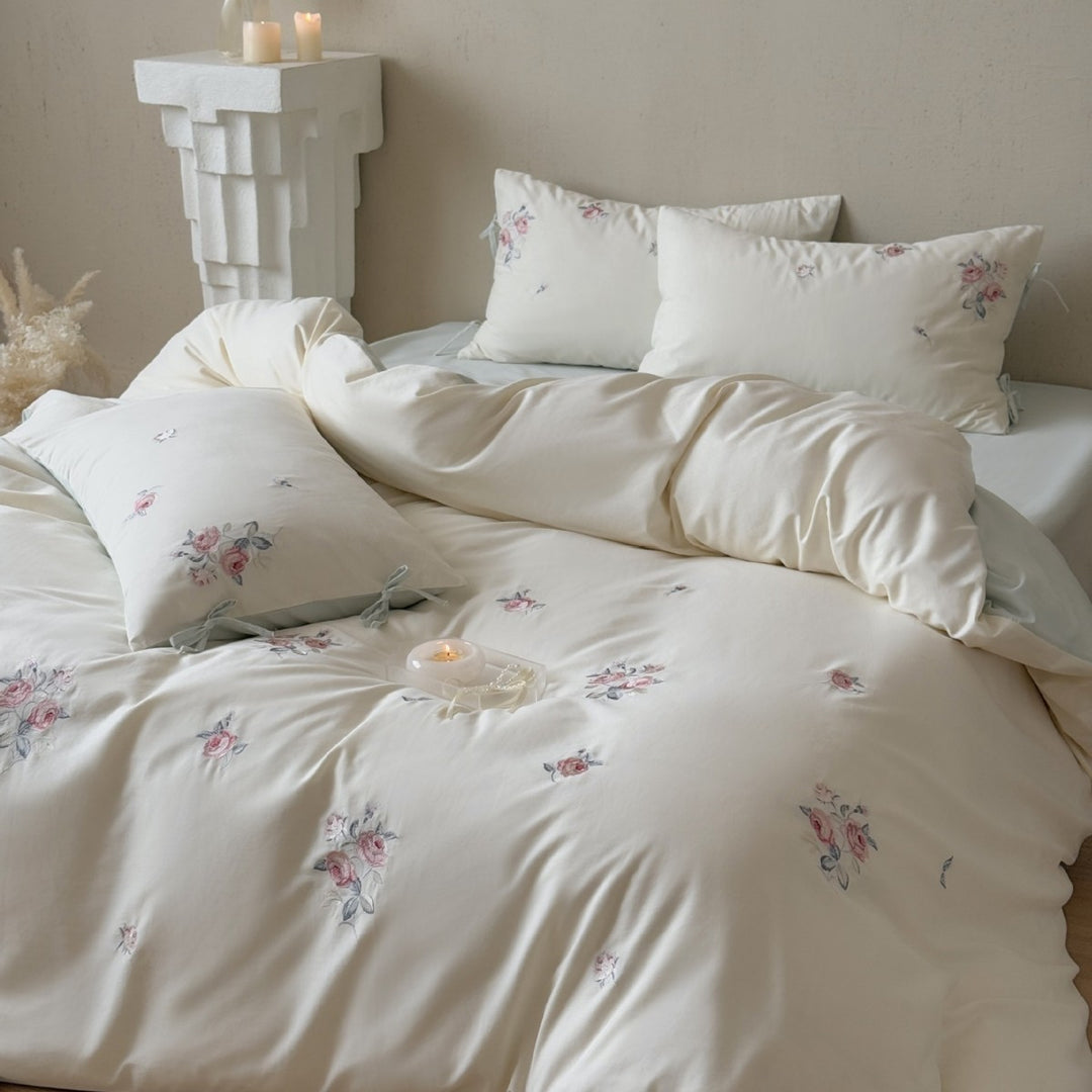 Luxurious cotton bedding set with delicate floral embroidery and reversible pillowcases