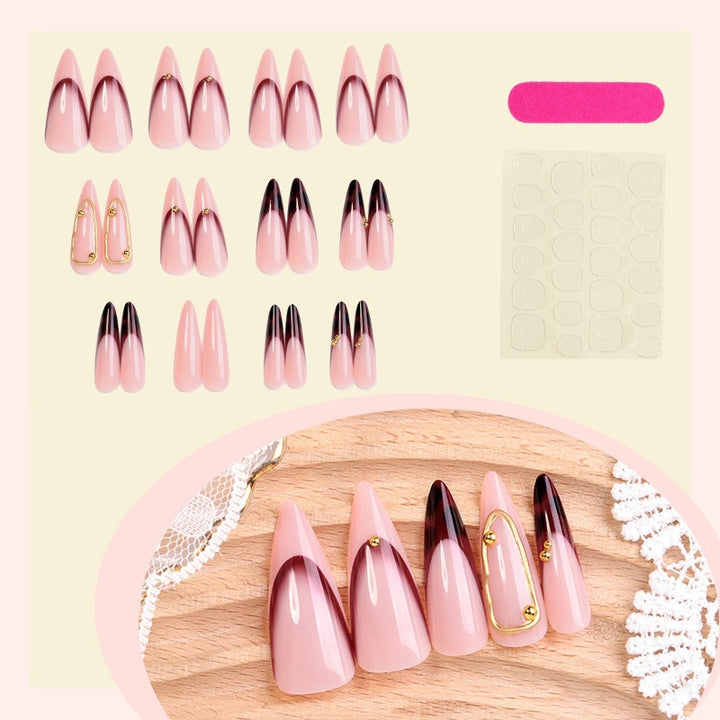 Acrylic nail set with elegant ombre design and golden accents Stornfield
