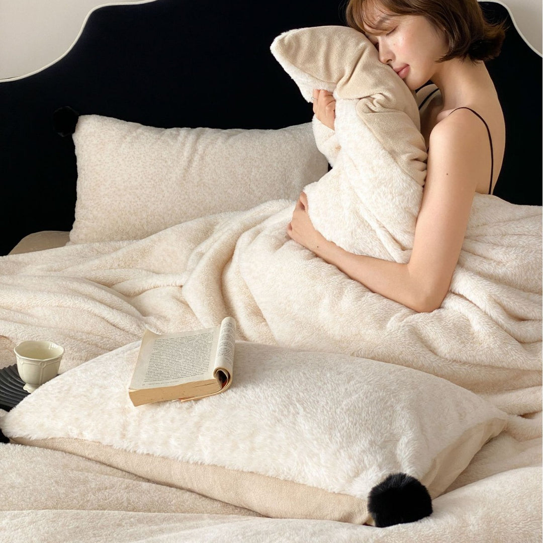 Bedding set made of soft cotton blend with decorative pom poms and reversible back
