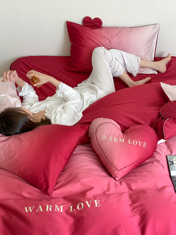 Luxurious satin bedding set with heart pillow and reversible function