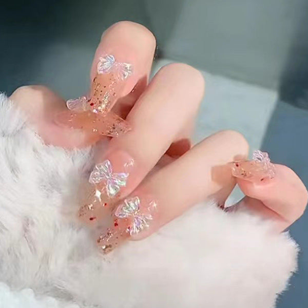 Glamorous artificial nails with delicate flower and glitter effects Stornfield