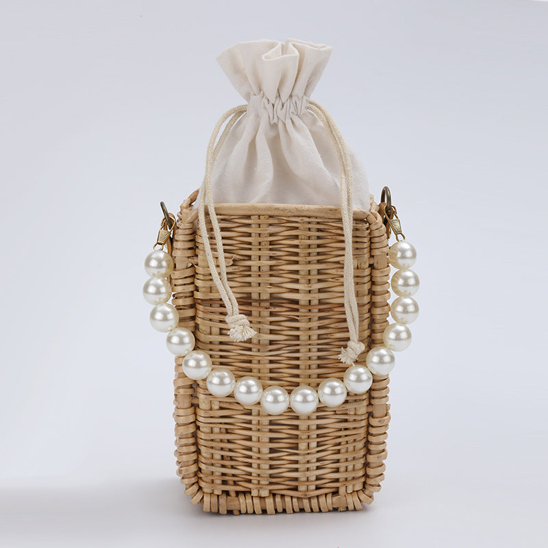 Women's handbag made of woven material with pearl accents Stornfield