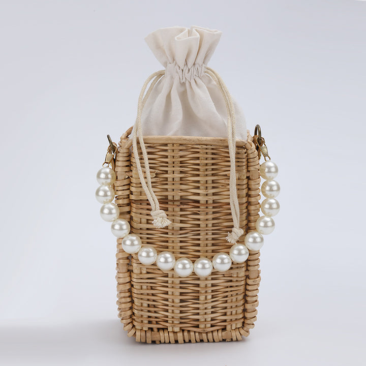 Women's handbag made of woven material with pearl accents Stornfield
