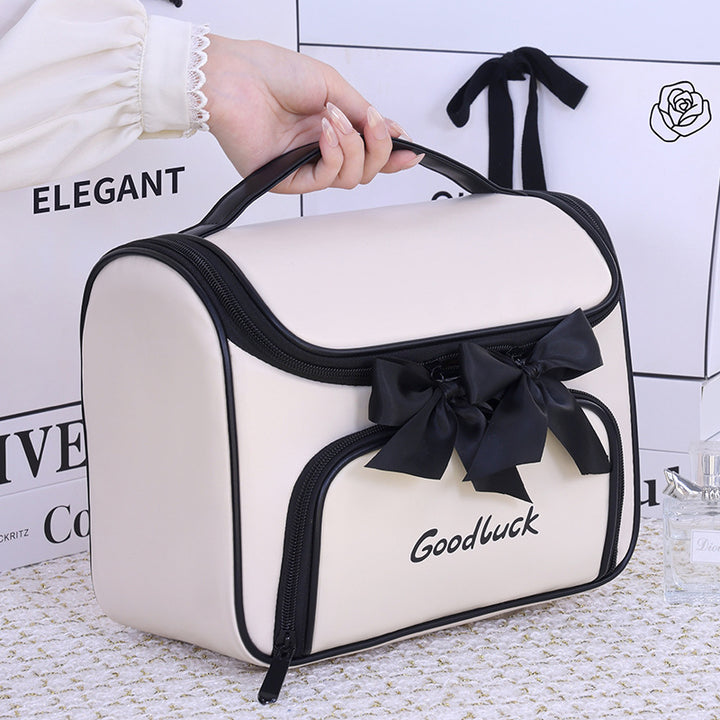 Cosmetic and toiletry bag with elegant bow accent Stornfield
