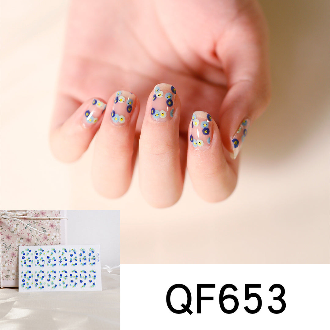 Artificial nail art with heart-shaped designs and soft color gradients Stornfield