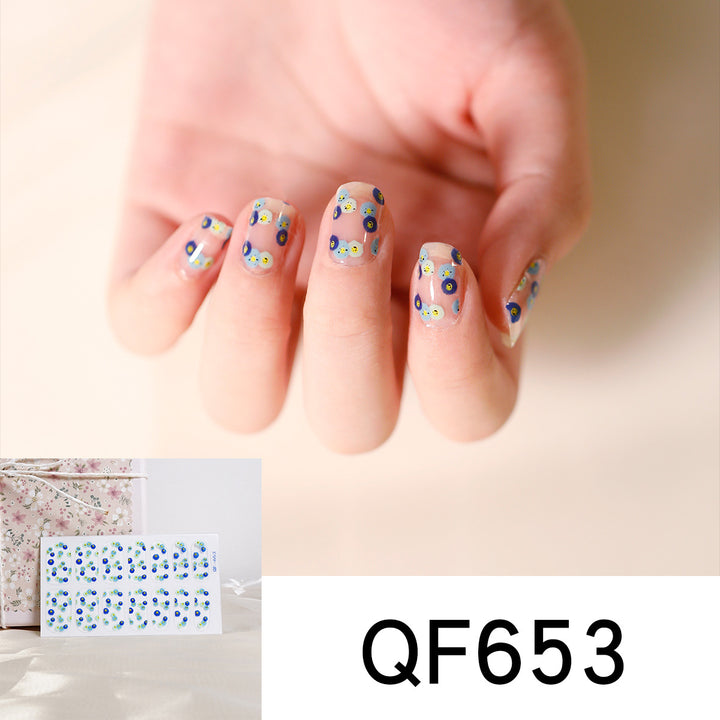Artificial nail art with heart-shaped designs and soft color gradients Stornfield
