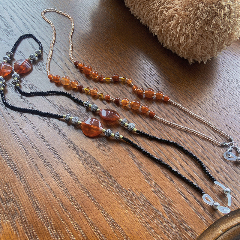 Stylish glasses holder chain with colorful accents Stornfield