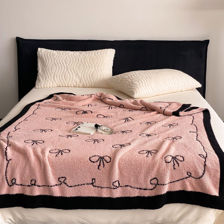 Reversible cuddly blanket made of terry cloth with decorative dog motif