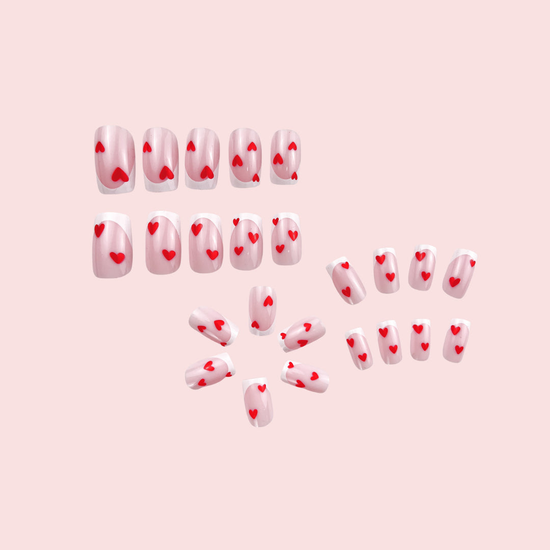 Heart-Embellished French Tip Nail Art Stornfield