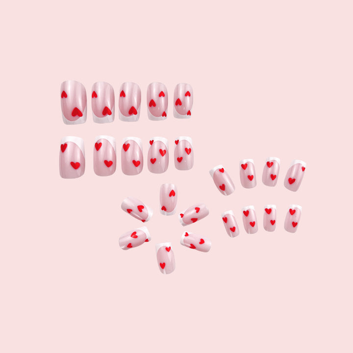 Heart-Embellished French Tip Nail Art Stornfield