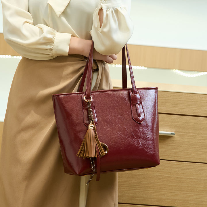 Elegant Structured Handbag with Tassel Detail