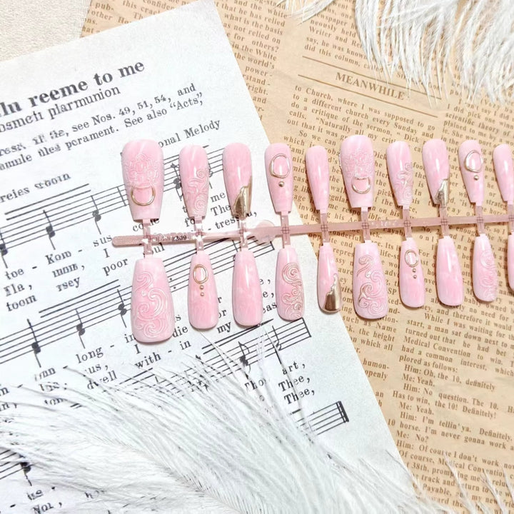 Artificial nails with elegant gold embellishments Stornfield