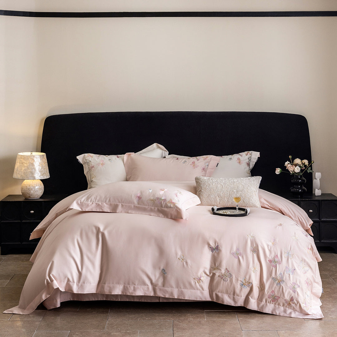 Premium bedding set made of extra soft cotton satin with delicate butterfly embroidery and concealed hotel closure