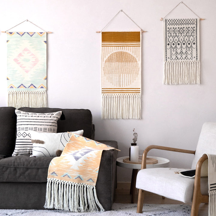 Woven Boho wall tapestry in Ethno design with long fringes and wood stick Stornfield