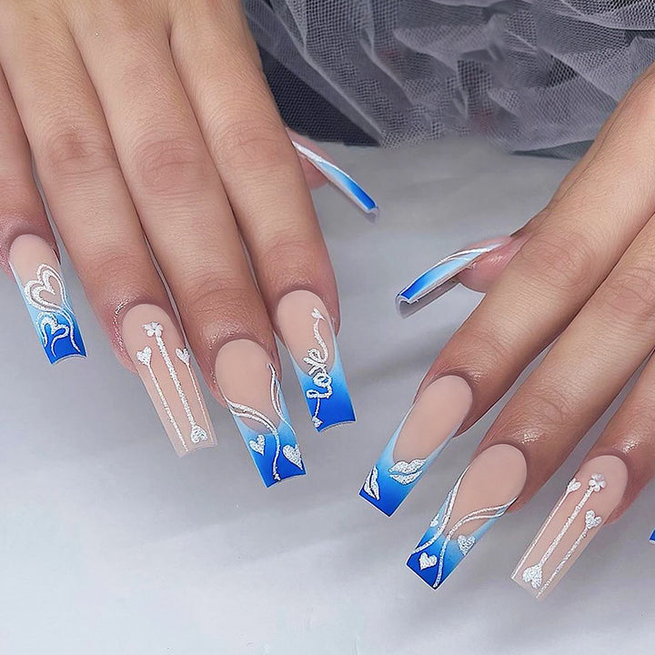 Creative nail art set with elegant heart and gradient patterns Stornfield