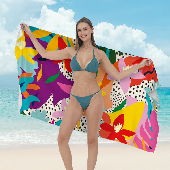 Beach towel with vibrant tropical plant motif Stornfield